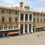 Vicenza, Italy - April 25, 2014: View of Piazza dei Signori at twilight with the Loggia del Capitaniato) seen from the Basilica of Andrea Palladio. The dramatic perspective is create by the usage of an extreme wide angle lens.